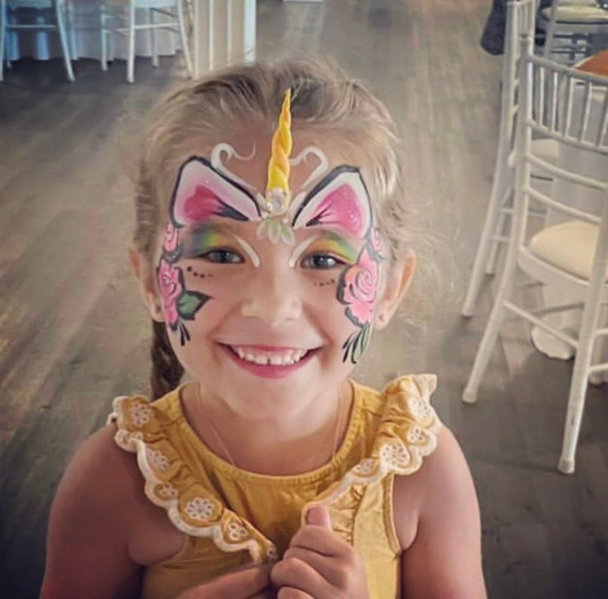Professional face painter at an upscale children's event