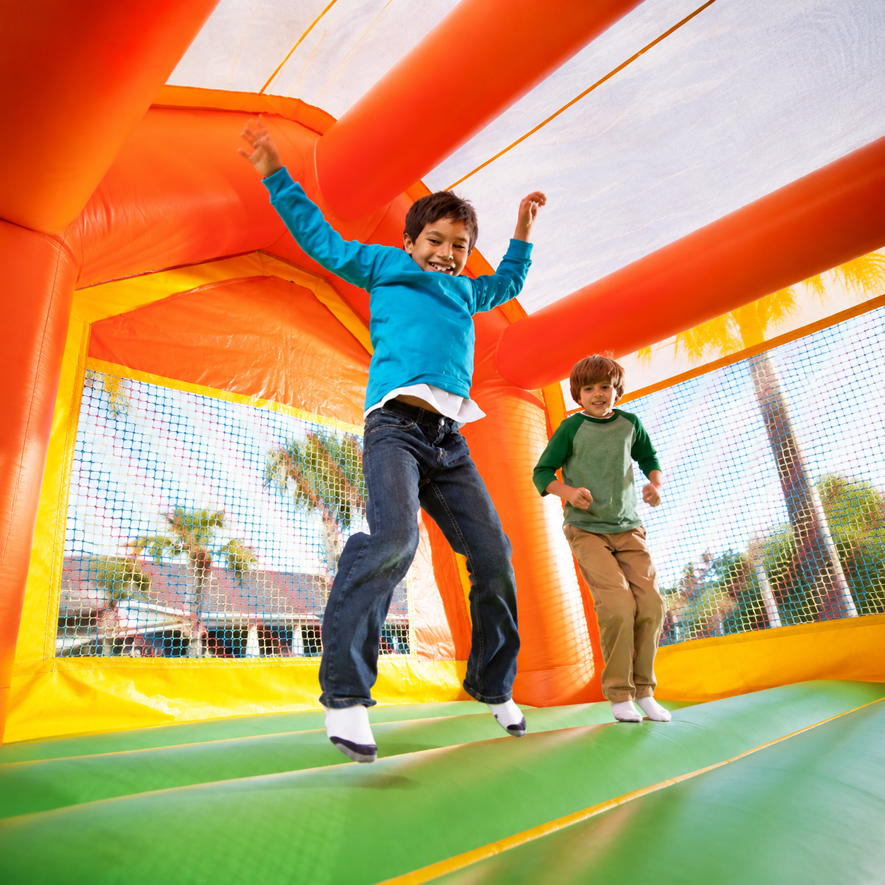 Immersive attractions including bounce houses and game trucks